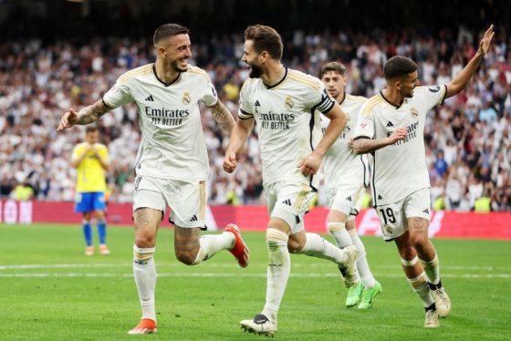Real Madrid Players Celebrating After Scoring a Goal in La Liga
