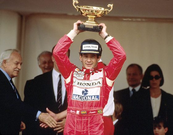 Ayrton Senna, Pictured on the Podium Here, Is One of the Greatest F1 Drivers in History