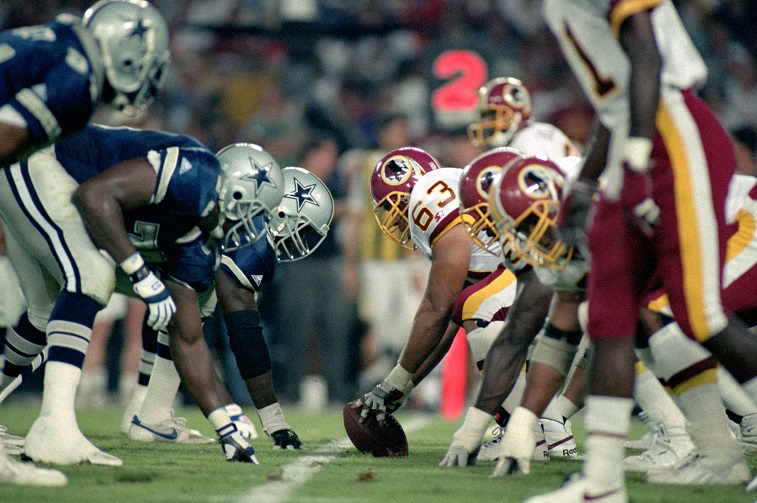 WASHINGTON - SEPTEMBER 6: The Washington Redskins offense lines up against the Dallas Cowboys during the NFL game at RFK Stadium on September 6, 1993 in Washington, D.C. The Redskins defeated the Cowboys 35-16.