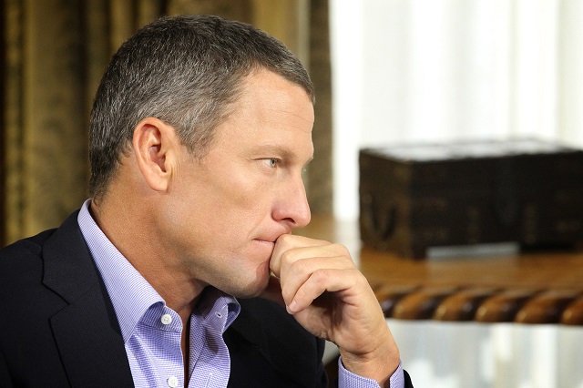 Lance Armstrong looks serious during an interview