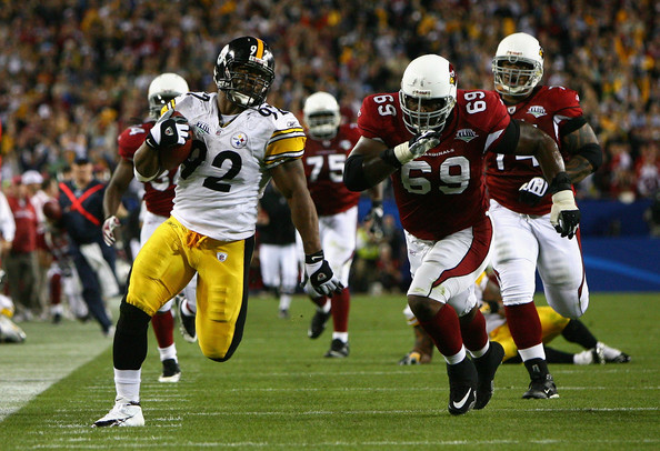 James Harrison runs as fast as he can.