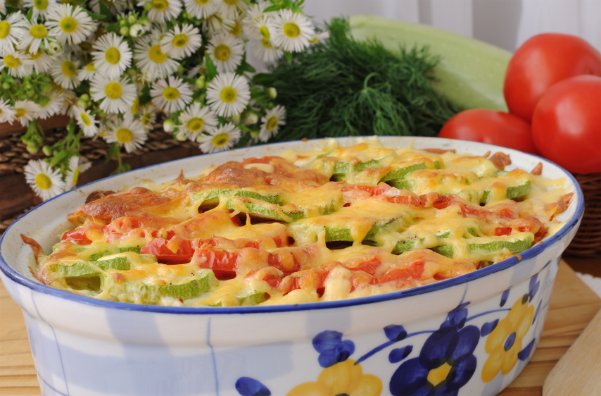 casserole of pasta with zucchini and tomato , cheese