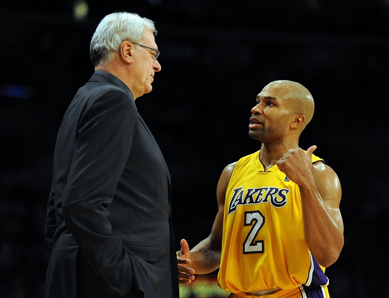 LOS ANGELES, CA - DECEMBER 01: Derek Fisher #2 of the Los Angeles Lakers speaks to Head Coach Phil Jackson during the game against the New Orleans Hornets at Staples Center on December 1, 2009 in Los Angeles, California. (Photo by Harry How/Getty Images) NOTE TO USER: User expressly acknowledges and agrees that, by downloading and/or using this Photograph, user is consenting to the terms and conditions of the Getty Images License Agreement.