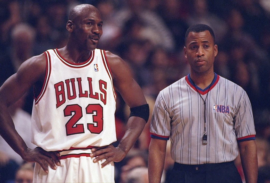 27 Dec 1997: Guard Michael Jordan of the Chicago Bulls confers with an official during a game against the Atlanta Hawks at the United Center in Chicago, Illinois. The Bulls won the game, 97-90. 