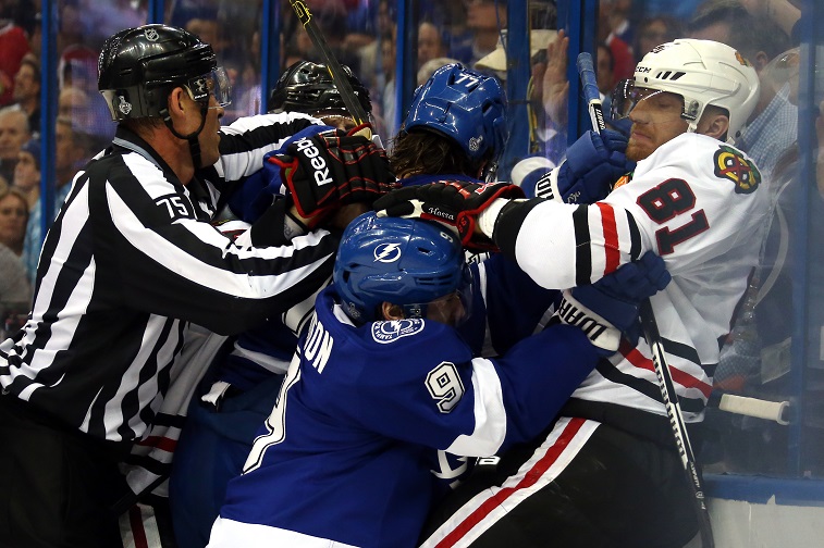 An official breaks up one of the worst NHL fights.