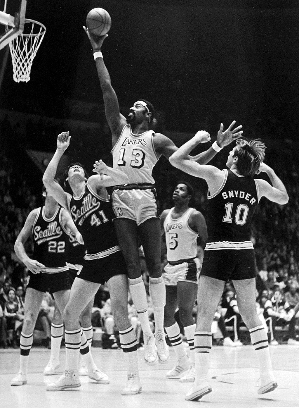 In this 22 November 1970 photo, Los Angeles Lakers basketball legend Wilt Chamberlain is shown shooting a layup during a game against Seattle. 