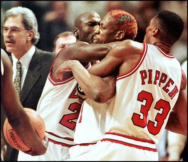 Dennis Rodman has to be restrained.
