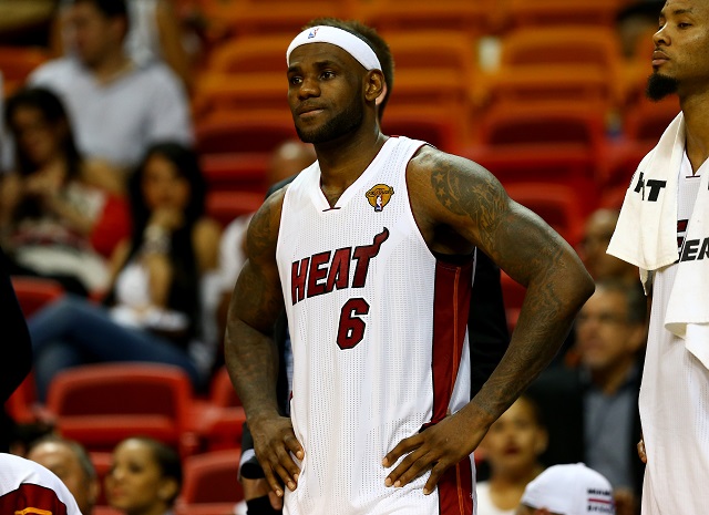 LeBron stands on the sidelines donning his old Miami Heat jersey.