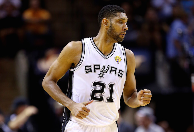 Tim Duncan runs down the court in his San Antonio Spurs uniform.