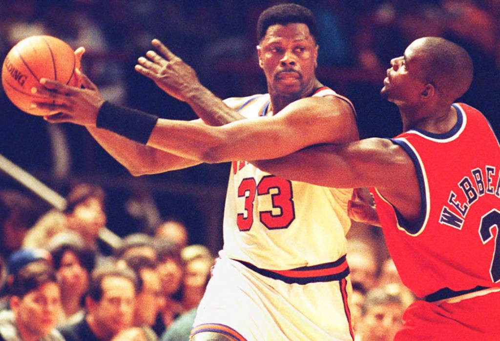 Patrick Ewing goes to work on Chris Webber.