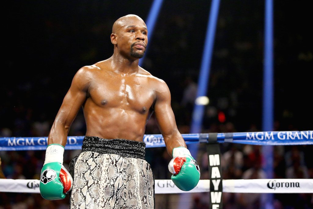 Floyd Mayweather stands in the ring during a match