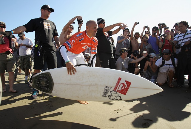 kelly slater with a surfboard