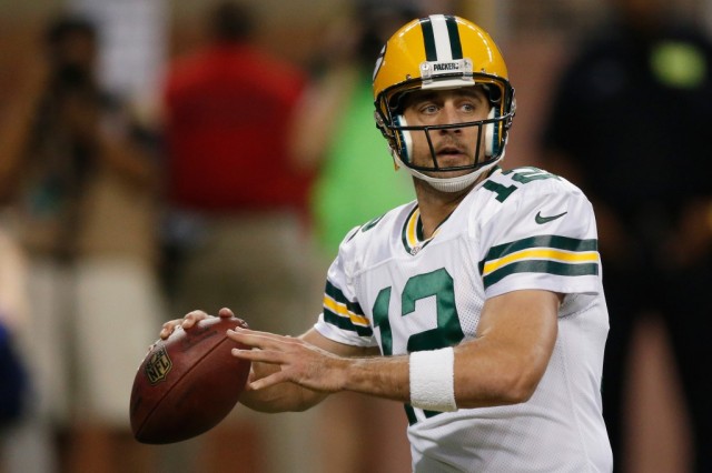Aaron Rodgers sets to throw a pass