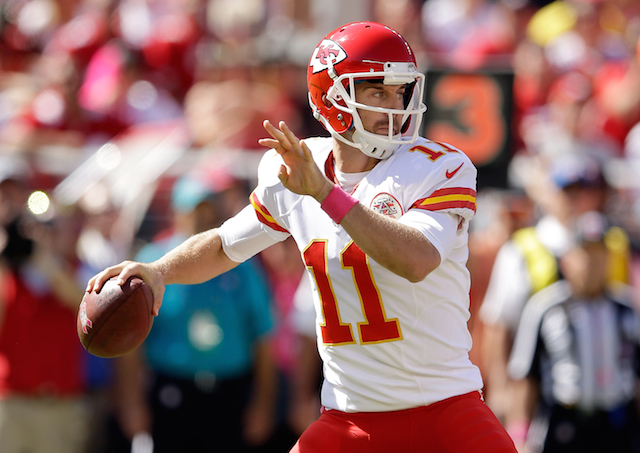 Alex Smith looks for a target.
