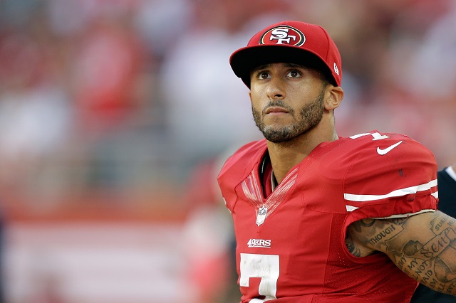 Colin Kaepernick looks on during the game