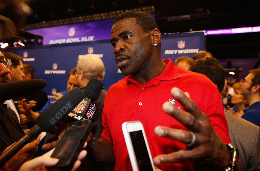 Michael Irvin addressing the media.