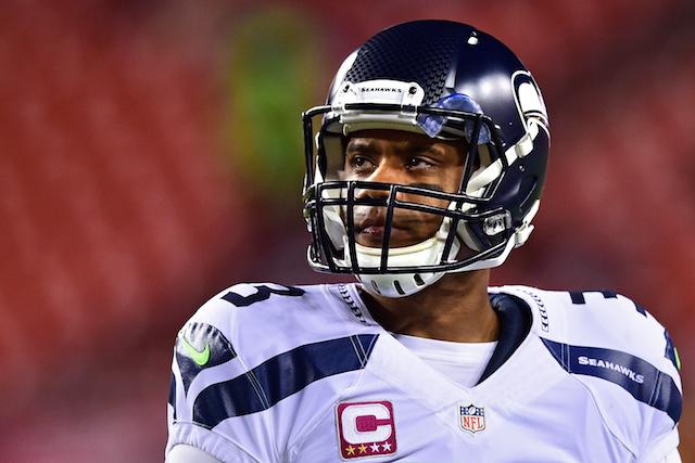 Russell Wilson looks on during a game against the Redskins