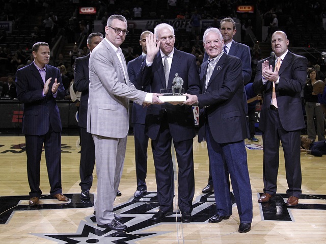 Gregg Popovich waves to his fans as he receives an award.