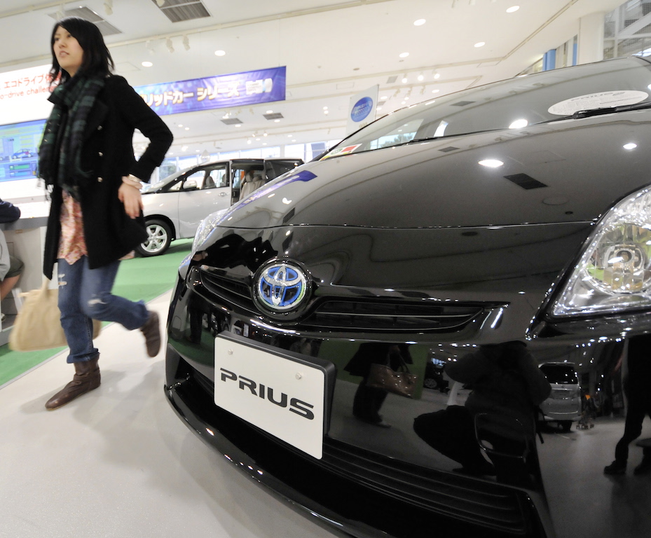 a black prius at a car show a black prius at a car show