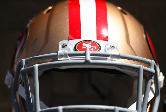 A San Francisco 49ers helmet rests on a stand