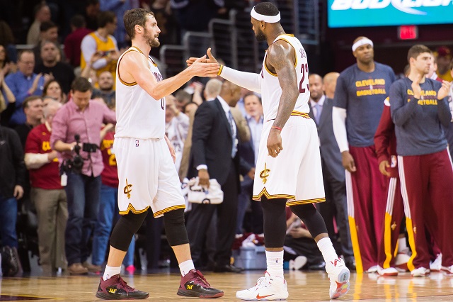 CLEVELAND, OH - DECEMBER 15: Kevin Love #0 and LeBron James #23 of the Cleveland Cavaliers celebrate after the Cavaliers defeat the Charlotte Hornets at Quicken Loans Arena on December 15, 2014 in Cleveland, Ohio. The Cavaliers defeated the Hornets 97-88. NOTE TO USER: User expressly acknowledges and agrees that, by downloading and or using this photograph, User is consenting to the terms and conditions of the Getty Images License Agreement.