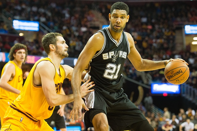 CLEVELAND, OH - NOVEMBER 19: Kevin Love #0 of the Cleveland Cavaliers puts pressure on Tim Duncan #21 of the San Antonio Spurs during the first half at Quicken Loans Arena on November 19, 2014 in Cleveland, Ohio. (Photo by Jason Miller/Getty Images)