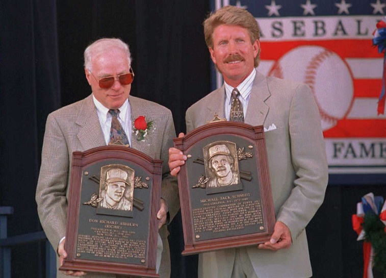 COOPERSTOWN, NY - JULY 30: Richie Ashburn (L) and Mike Schmidt (R) hold their plaques after their induction into the National Baseball Hall of Fame 30 July in Cooperstown, NY. The two former Philadelphia Phillies joined a total of five inductees in today's ceremony.