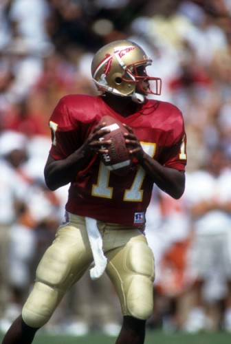 Charlie Ward looks for a target down the field.