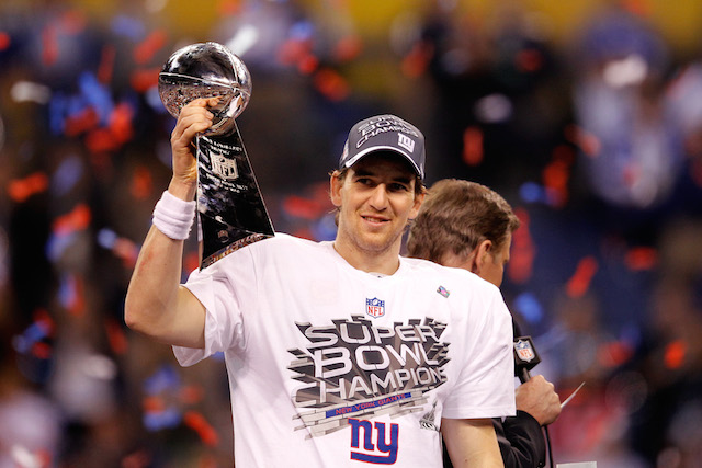 Eli Manning grips the Lombardi Trophy after beating the New England Patriots.
