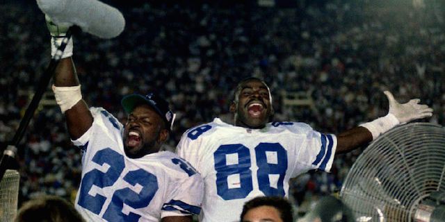 PASADENA - JANUARY 31: Emmitt Smith #22 and Michael Irvin #88 of the Dallas Cowboys celebrate on January 31, 1993 during the fourth quarter of Super Bowl XXVII in Pasadena, California. The Cowboys defeated the Buffalo Bills 52-17 to win Super Bowl XXVII. AFP (Photo credit should read CHRIS WILKINS/AFP/Getty Images)