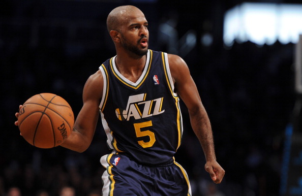 John Lucas III #5 of the Utah Jazz carries the ball down court against the Brooklyn Nets