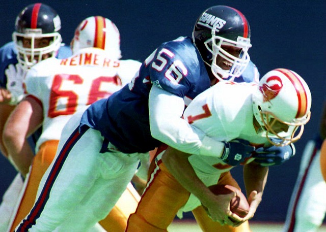 EAST RUTHERFORD, NJ - SEPTEMBER 12: New York Giants linebacker Lawrence Taylor sacks Tampa Bay Buccaneers quarterback Craig Erickson during the second quarter 12 September 1993, in East Rutherford, New Jersey. The Giants won the game 23-7. 