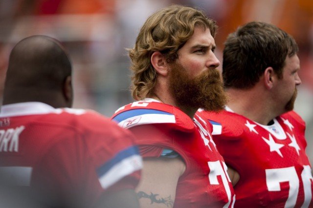 Matt Light looks at his teammates on the field.