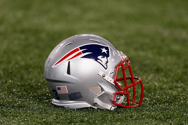 A New England helmet rests on the field.