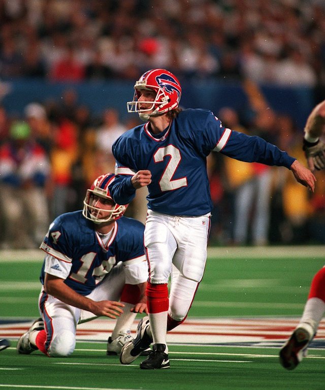 Steve Christie follows the line of a ball.