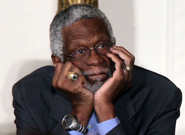 Bill Russell listens during a press conference.