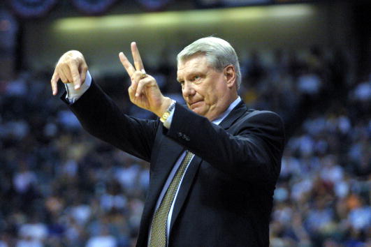 Don Nelson holds up his fingers to signal a play.