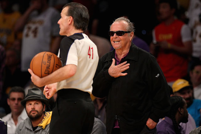 Jack Nicholson harasses the referee from the sidelines.