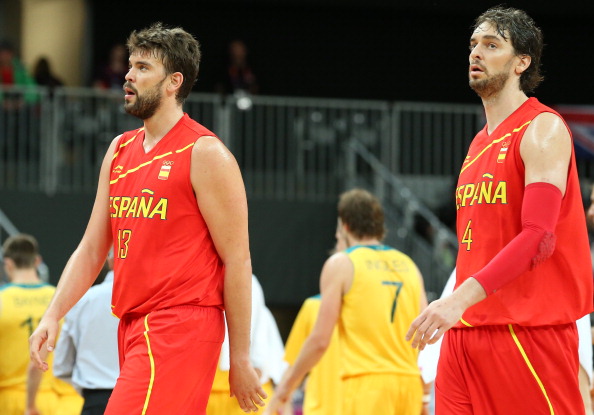 Marc and Pau Gasol walk across the court.