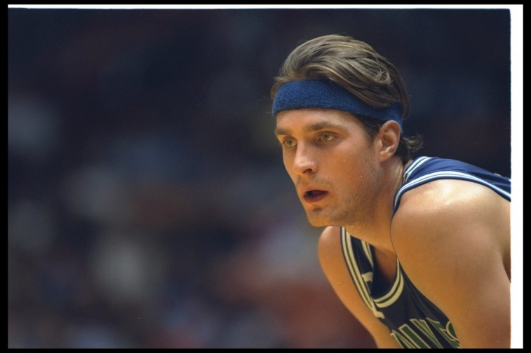 Christian Laettner watches the game intently.