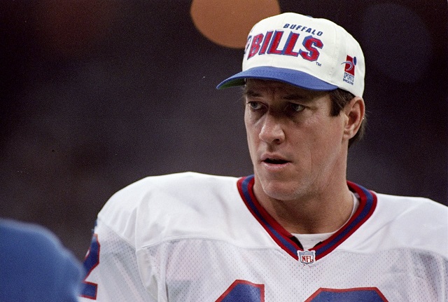 Jim Kelly looks on from the sidelines.