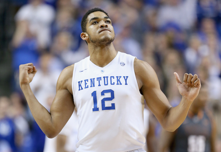Karl Anthony Towns pumps his fists after scoring for Kentucky.