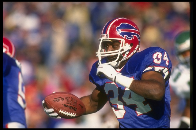 2 Dec 1990: Running back Thurman Thomas of the Buffalo Bills runs with the ball during a game against the Philadelphia Eagles at Rich Stadium in Orchard Park, New York. The Bills won the game, 30-23.