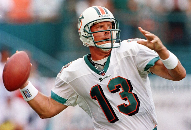 MIAMI, :  Miami Dolphins quarterback Dan Marino gets ready to throw a pass in first quarter action in Mimi's NFL season opener against the Indianapolis Colts 31 August at Pro Player Stadium in Miami, FL. Marino is starting his 15th year as Dolphins quarterback.