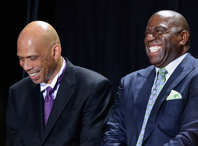 LOS ANGELES, CA - NOVEMBER 16: Los Angeles Lakers legend Kareem Abdul-Jabbar (L) and Earvin "Magic" Johnson during a ceremony where Abdul-Jabbar unveiled a statue of himself at Staples Center on November 16, 2012 in Los Angeles, California. (Photo by Kevork Djansezian/Getty Images)