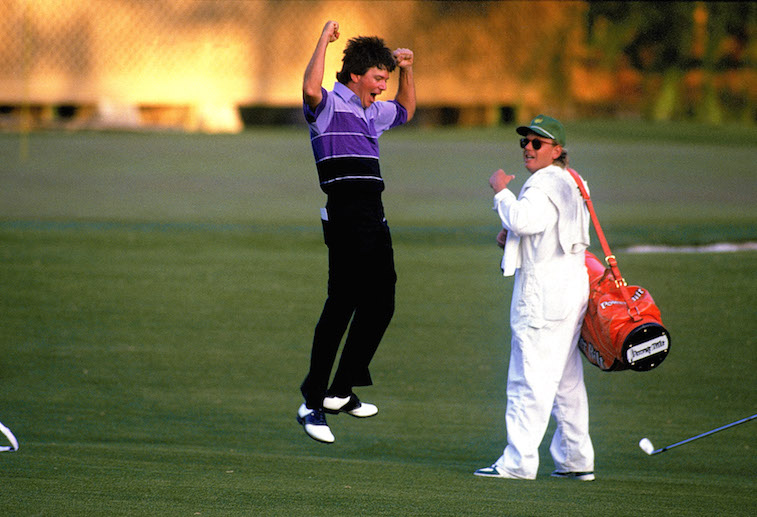 Larry Mize celebrates with his caddy.
