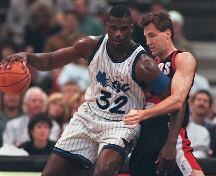 Shaquille O'Neal backing in a defender