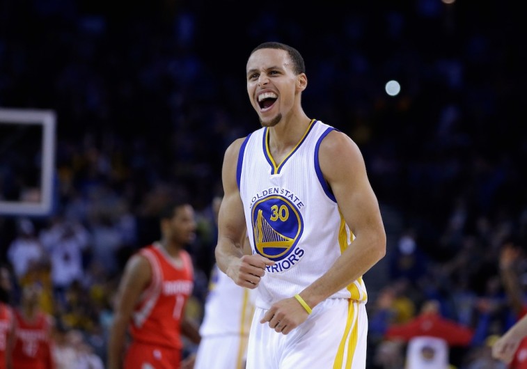 Stephen Curry reacts to a play against the Rockets