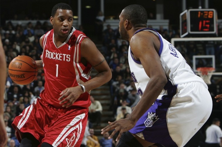 Tracy McGrady dribbles around a defender | Getty Images