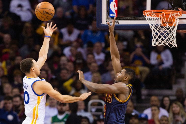 Stephen Curry shoots over Tristan Thompson in NBA Finals